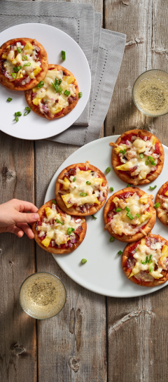 Mini Hawaiian Pizzas with Maple Bacon and Kingsey<sup>® </sup>Shredded Pizza Mozzarella Cheese